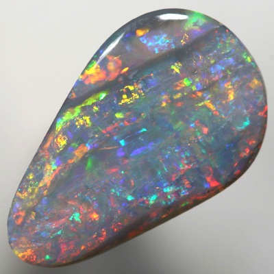 SOLID SEMI BLACK OPAL Sparkling bright red over green, Banded pattern. SEE VIDEO